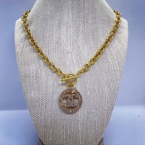 Authentic Chanel button used to create a new necklace